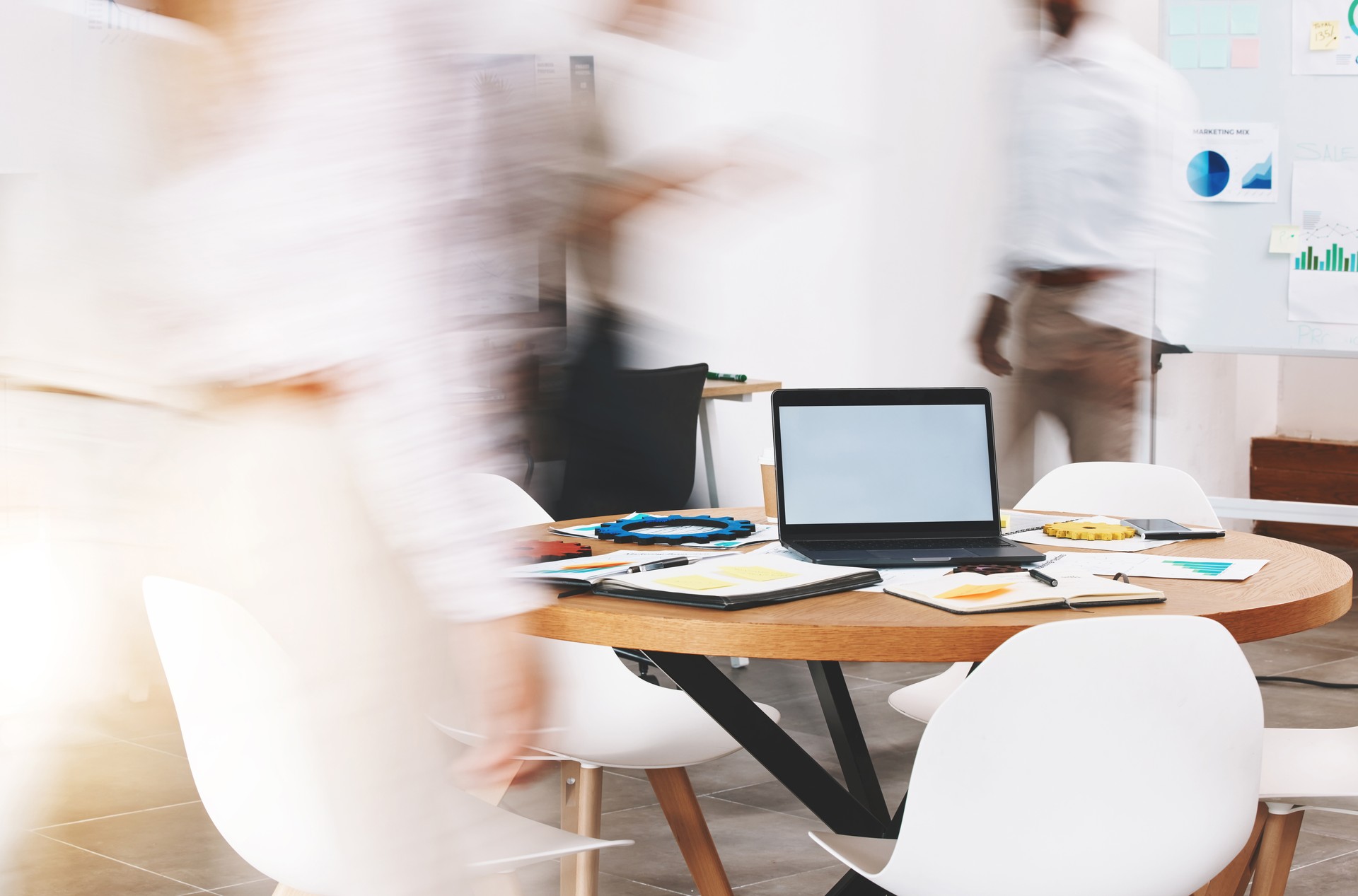 Laptop mockup, busy office and blurred background marketing agency, startup company and fast workplace. Business meeting table, planning and working on computer screen, technology and stats documents